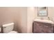 Small bathroom with single sink vanity and toilet at 1600 Watercress Se Ct, Mableton, GA 30126
