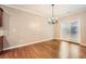 Bright dining room with hardwood floors and chandelier at 1600 Watercress Se Ct, Mableton, GA 30126