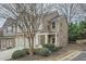Brick townhome with a charming pergola and landscaped yard at 1600 Watercress Se Ct, Mableton, GA 30126