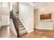 Elegant staircase with wrought iron railing and hardwood floors at 1600 Watercress Se Ct, Mableton, GA 30126
