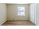 Bright bedroom with neutral walls and carpet at 4312 Pleasant Forest Dr, Decatur, GA 30034