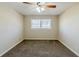 Spacious bedroom with ceiling fan and carpet at 4312 Pleasant Forest Dr, Decatur, GA 30034