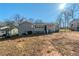 Gray house exterior with a sunlit backyard at 4312 Pleasant Forest Dr, Decatur, GA 30034