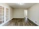 Living room with hardwood floors and French doors at 4312 Pleasant Forest Dr, Decatur, GA 30034