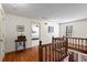 Upstairs hallway with hardwood floors and bedroom access at 4958 Highpoint Ne Way, Marietta, GA 30066