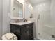 Updated bathroom with walk-in shower, marble vanity, and modern fixtures at 1365 Sanden Ferry Dr, Decatur, GA 30033