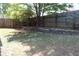 Landscaped backyard with retaining walls at 162 Gainesborough Dr, Dallas, GA 30157