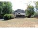 Large backyard with spacious lawn and partial view of pool at 162 Gainesborough Dr, Dallas, GA 30157