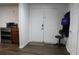 Basement entry with double doors, wood floors, and stainless steel appliances at 162 Gainesborough Dr, Dallas, GA 30157