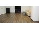 Finished basement with dark hardwood floors and TV at 162 Gainesborough Dr, Dallas, GA 30157