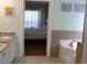 Bright bathroom includes a bathtub and a view into bedroom at 162 Gainesborough Dr, Dallas, GA 30157