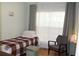 Bedroom with a twin bed and an armchair by the window at 162 Gainesborough Dr, Dallas, GA 30157