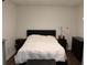 Simple bedroom with a queen bed and dark wood floors at 162 Gainesborough Dr, Dallas, GA 30157
