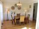 Bright dining room with hardwood floors, granite table, and wainscoting at 162 Gainesborough Dr, Dallas, GA 30157