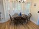 Eat-in kitchen area with hardwood floors and wood table with chairs at 162 Gainesborough Dr, Dallas, GA 30157