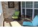 Relaxing front porch with two chairs and a small table at 162 Gainesborough Dr, Dallas, GA 30157