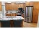 Kitchen features granite countertops, stainless steel appliances, and wood cabinets at 162 Gainesborough Dr, Dallas, GA 30157