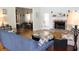 Spacious living room with hardwood floors, fireplace, and views to the kitchen and dining area at 162 Gainesborough Dr, Dallas, GA 30157