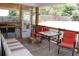 Relaxing screened porch with seating and outdoor table at 162 Gainesborough Dr, Dallas, GA 30157