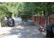 Side yard with patio, grill, and wood fence at 162 Gainesborough Dr, Dallas, GA 30157