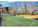 Large backyard with fenced area and green lawn at 185 Glen Holly Dr, Roswell, GA 30076