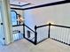 Elegant staircase with chandelier and white railings at 2260 Cobble Creek Ln, Grayson, GA 30017