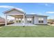 Covered patio and fenced backyard with new sod at 2798 Turnwater St, Hoschton, GA 30548