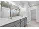 Double vanity bathroom with a walk-in shower and large mirror at 2798 Turnwater St, Hoschton, GA 30548
