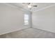 Well-lit bedroom with window and ceiling fan at 2798 Turnwater St, Hoschton, GA 30548