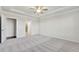 Bright bedroom with carpeted floor, ceiling fan and en-suite bathroom at 2798 Turnwater St, Hoschton, GA 30548