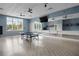 Fitness studio with ping pong table and wall-mounted mirrors at 2798 Turnwater St, Hoschton, GA 30548