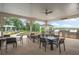 Outdoor kitchen and dining area with grills and seating at 2798 Turnwater St, Hoschton, GA 30548