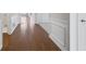 Bright hallway with hardwood floors and wainscoting at 2798 Turnwater St, Hoschton, GA 30548