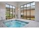 Relaxing hot tub with large windows and natural light at 2798 Turnwater St, Hoschton, GA 30548