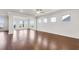 Open living room with hardwood floors and lots of natural light at 2798 Turnwater St, Hoschton, GA 30548