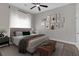 Relaxing bedroom with a plush bed, neutral tones, lots of gallery wall art, and decorative bench at 1794 Spring Ne St, Conyers, GA 30012