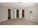 Spacious bedroom with neutral walls, carpet, and ample closet space at 5321 Sherwin Dr, Norcross, GA 30093