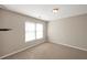 Spacious bedroom with neutral walls and carpet flooring at 5321 Sherwin Dr, Norcross, GA 30093