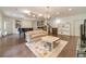 Finished basement with hardwood floors, fireplace, and built in shelving at 5960 Overlook Club Cir, Suwanee, GA 30024