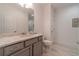 Clean basement bathroom with gray vanity, updated fixtures, and tile flooring at 5960 Overlook Club Cir, Suwanee, GA 30024