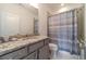 Clean bathroom with granite countertop and gray cabinets at 5960 Overlook Club Cir, Suwanee, GA 30024