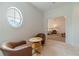 Relaxing sitting area with two armchairs and a view into a bedroom at 5960 Overlook Club Cir, Suwanee, GA 30024