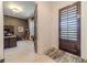 Bright entryway with view of home office and hardwood floors at 5960 Overlook Club Cir, Suwanee, GA 30024