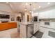 Modern kitchen with large island, stainless steel appliances, and granite countertops at 5960 Overlook Club Cir, Suwanee, GA 30024