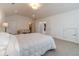 Large main bedroom with a cozy sitting area and access to other rooms at 5960 Overlook Club Cir, Suwanee, GA 30024