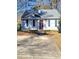 Cute ranch home with a gray roof, burgundy door and small front yard at 906 Westland Sw Dr, Marietta, GA 30064