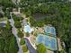 Community overview showing pool, tennis courts, and lake at 9970 Groomsbridge Rd, Johns Creek, GA 30022