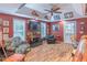 Finished basement recreation room with seating and TV at 9970 Groomsbridge Rd, Johns Creek, GA 30022