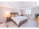 Main bedroom with tray ceiling and plenty of natural light at 9970 Groomsbridge Rd, Johns Creek, GA 30022