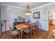 Formal dining room with hardwood floors and chandelier at 9970 Groomsbridge Rd, Johns Creek, GA 30022